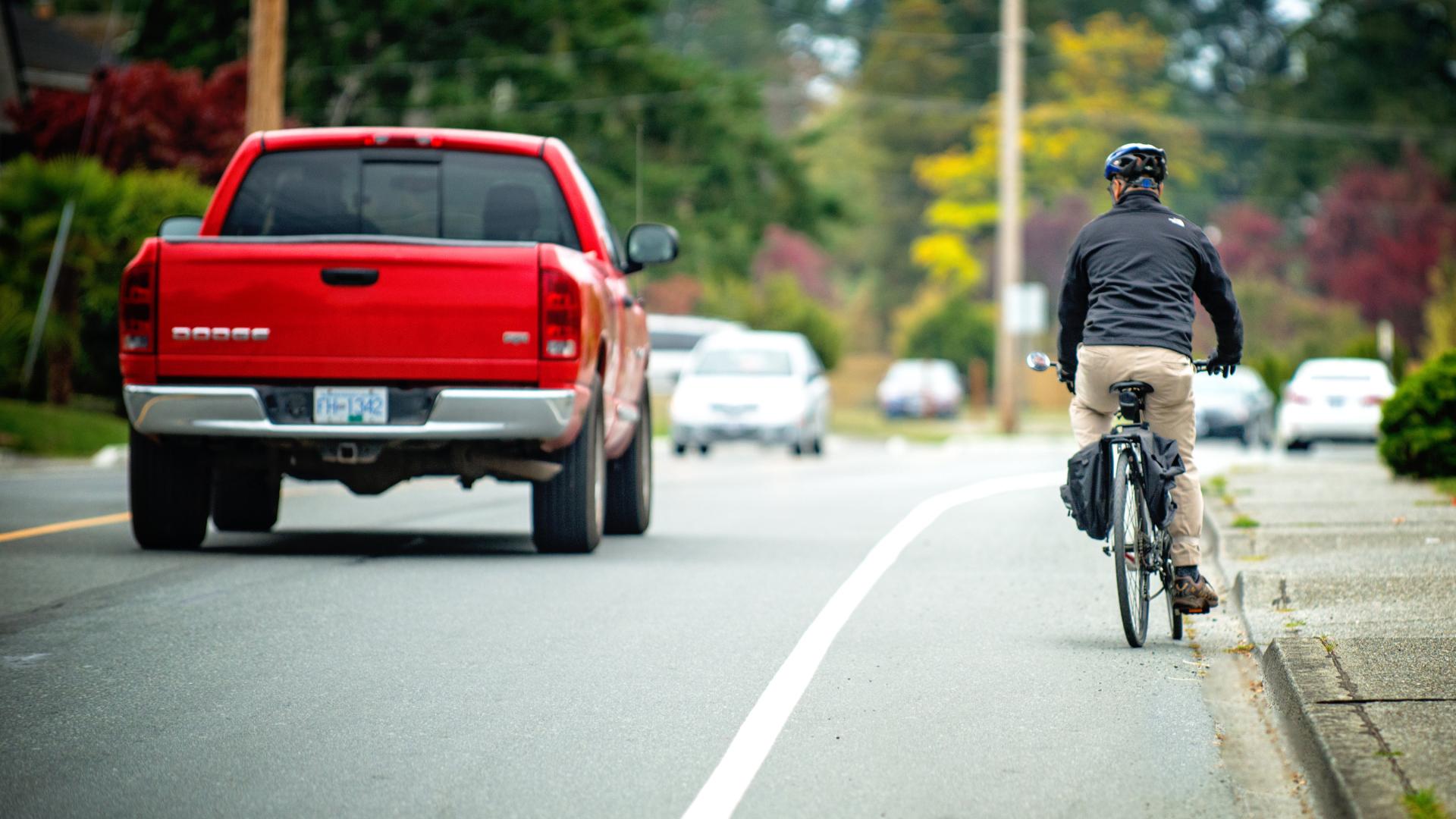 Truck and cyclist sharing road