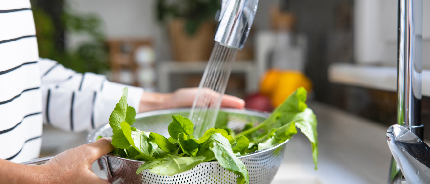 Person washing fresh produce